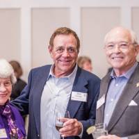 Guests smiling for a photo.